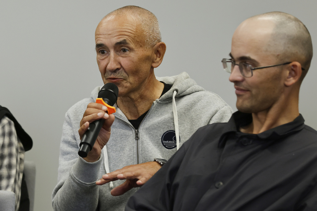 Henadz Fiadynich, left, speaks as a group of prisoners who were released by Belarusian authorities, attend a news conference in Vilnius, Lithuania, on Friday, Sept. 12, 2025. (AP Photo/Mindaugas Kulbis)