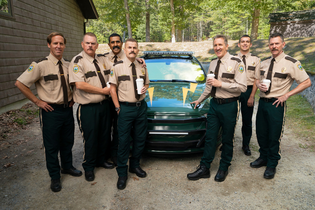 This image released by Searchlight Pictures shows, from left, Nat Faxon, Kevin Heffernan, Jay Chandrasekhar, Steve Lemme, Paul Soter, Andrew Dismukes, and Erik Stolhanske from the film "Super Troopers 3." (Patrick Harbron/Searchlight Pictures via AP)