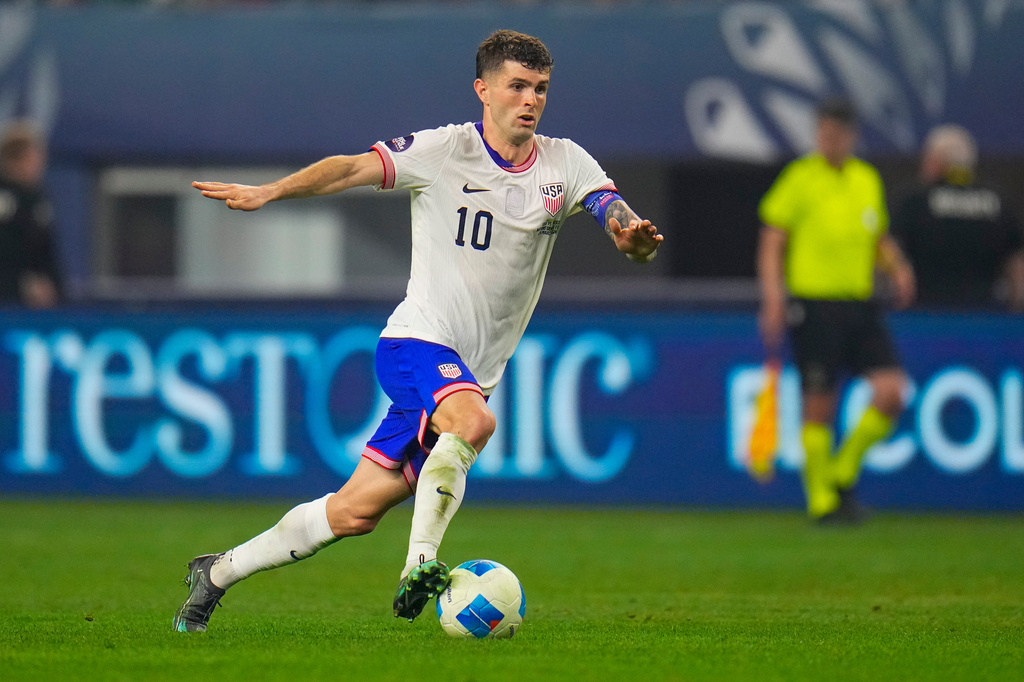 FILE - United States' Christian Pulisic dribbles during a CONCACAF Nations League championship soccer match between Mexico and the United States, Sunday, March 24, 2024, in Arlington, Texas. (AP Photo/Julio Cortez, File)