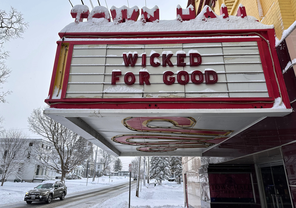A truck passes the local theater in Lowville, N.Y., on Friday, Nov. 28, 2025. (AP Photo/Cara Anna)