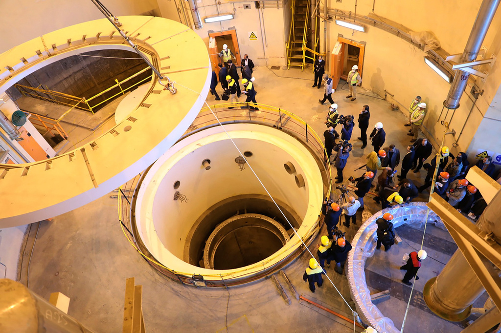 FILE - In this photo released by the Atomic Energy Organization of Iran, technicians work at the Arak heavy water reactor's secondary circuit as officials and media visit the site near Arak, Iran, Dec. 23, 2019. (Atomic Energy Organization of Iran via AP, File)