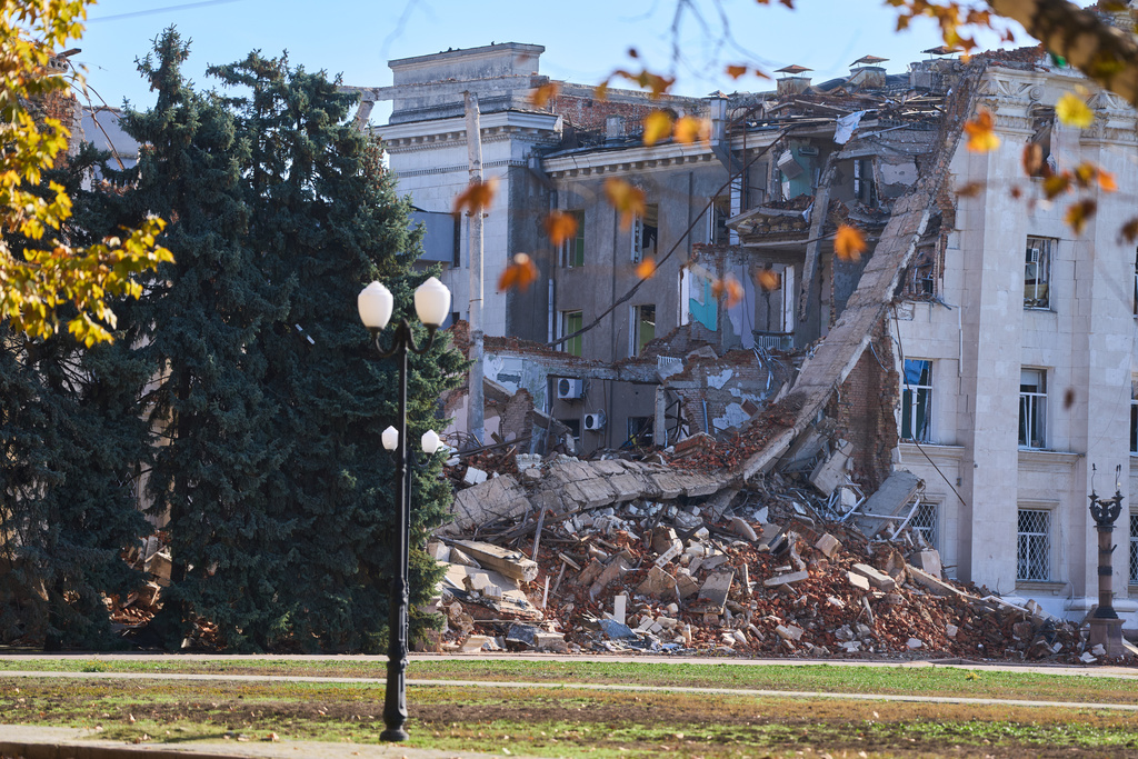 Ruined building of the regional administration following Russia's constant shelling is seen on the main square in the frontline city of Kherson, Southern Ukraine, Nov. 2, 2025. (AP Photo/Efrem Lukatsky)