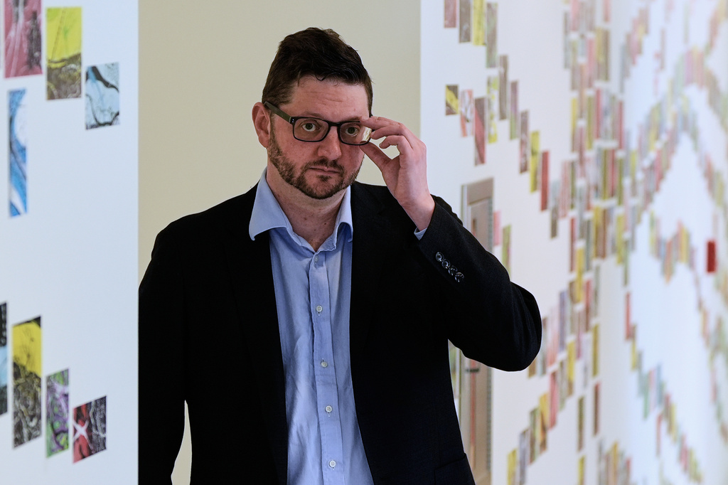 Benjamin Neale, co-director of the Stanley Center for Psychiatric Research, poses for a portrait near laboratory space at the Broad Institute, Tuesday, March 17, 2026, in Cambridge, Mass. (AP Photo/Charles Krupa)