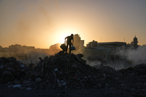 Palestinians search for firewood and plastic at a landfill in Gaza City Saturday, Oct. 25, 2025. (AP Photo/Abdel Kareem Hana) Palestinians search for firewood and plastic at a landfill in Gaza City Saturday, Oct. 25, 2025. (AP Photo/Abdel Kareem Hana)