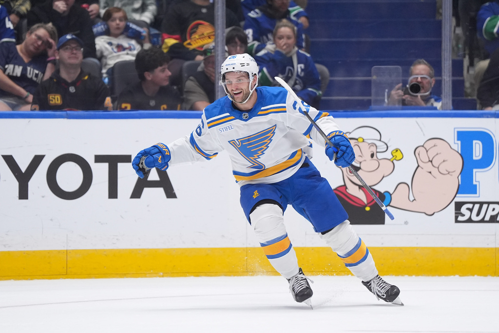 St. Louis Blues' Nathan Walker celebrates after his goal against the Vancouver Canucks during the second period of an NHL hockey game in Vancouver, British Columbia, Monday, Oct. 13, 2025. (Darryl Dyck/The Canadian Press via AP)