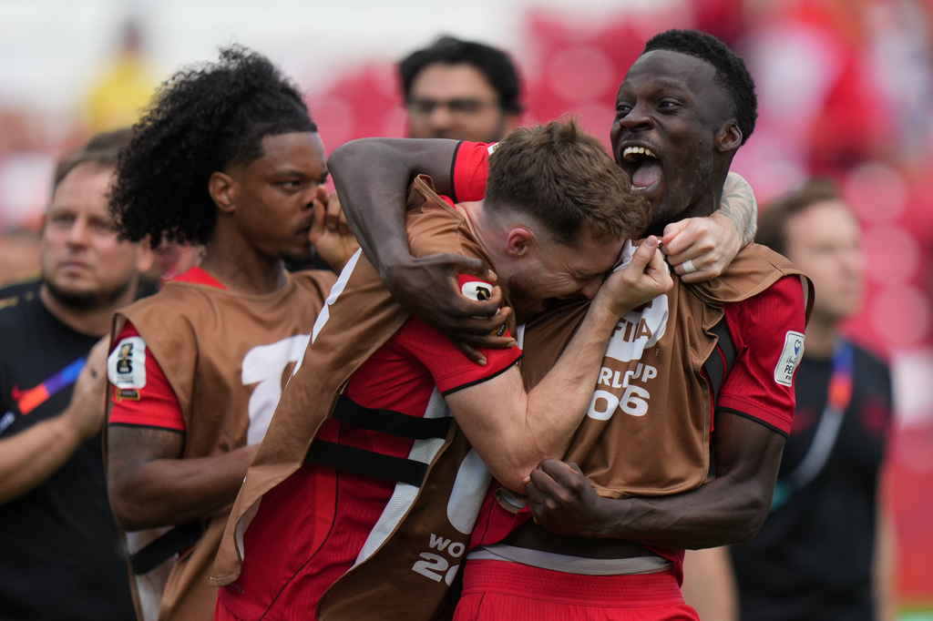 Canada's Joel Waterman, left and Canada's Tani Oluwaseyi, react after the end of the World Cup Group B soccer match between Canada and Bosnia in Toronto, Friday, June 12, 2026. (AP Photo/Stephanie Scarbrough)