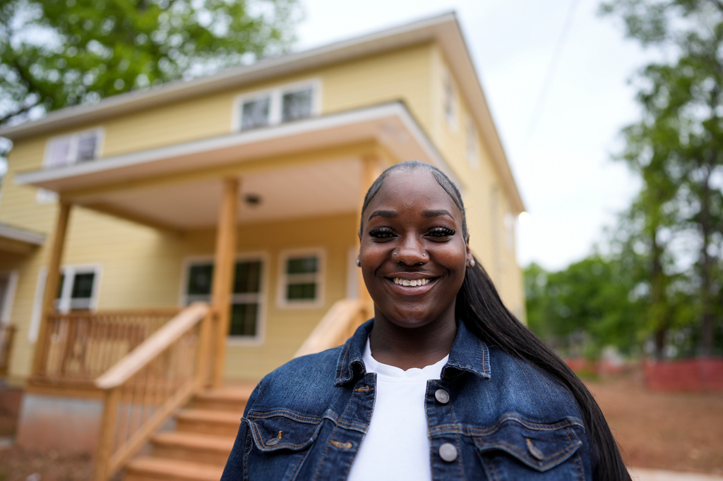 Home owner Phileena Daniel poses for a photo in Langston Park, April 13, 2026, in Atlanta. (AP Photo/Mike Stewart)