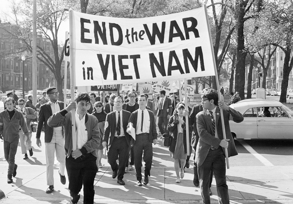 FILE - College students from various nearby schools march down Commonwealth Avenue in Boston on Oct. 16, 1965 to attend rally on Boston Common protesting U.S. involvement in Vietnam. (AP Photo/Frank C. Curtin, File)