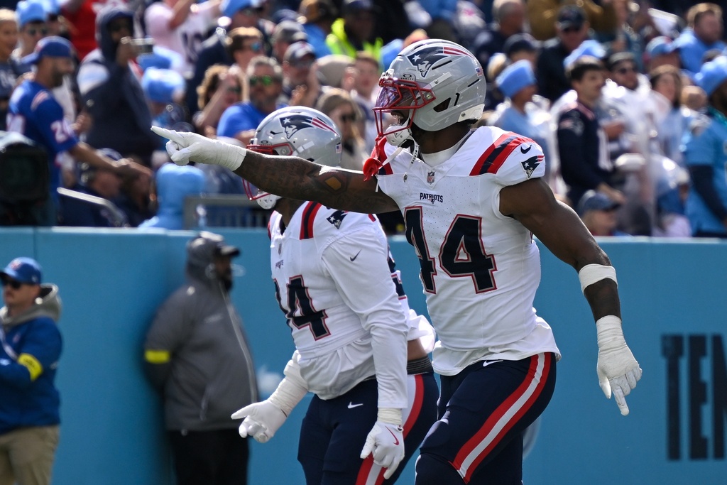 New England Patriots linebacker K'Lavon Chaisson (44) celebrates a fumble recovery for a touchdown during the second half of an NFL football game against the Tennessee Titans, Sunday, Oct. 19, 2025, in Nashville, Tenn. (AP Photo/John Amis)