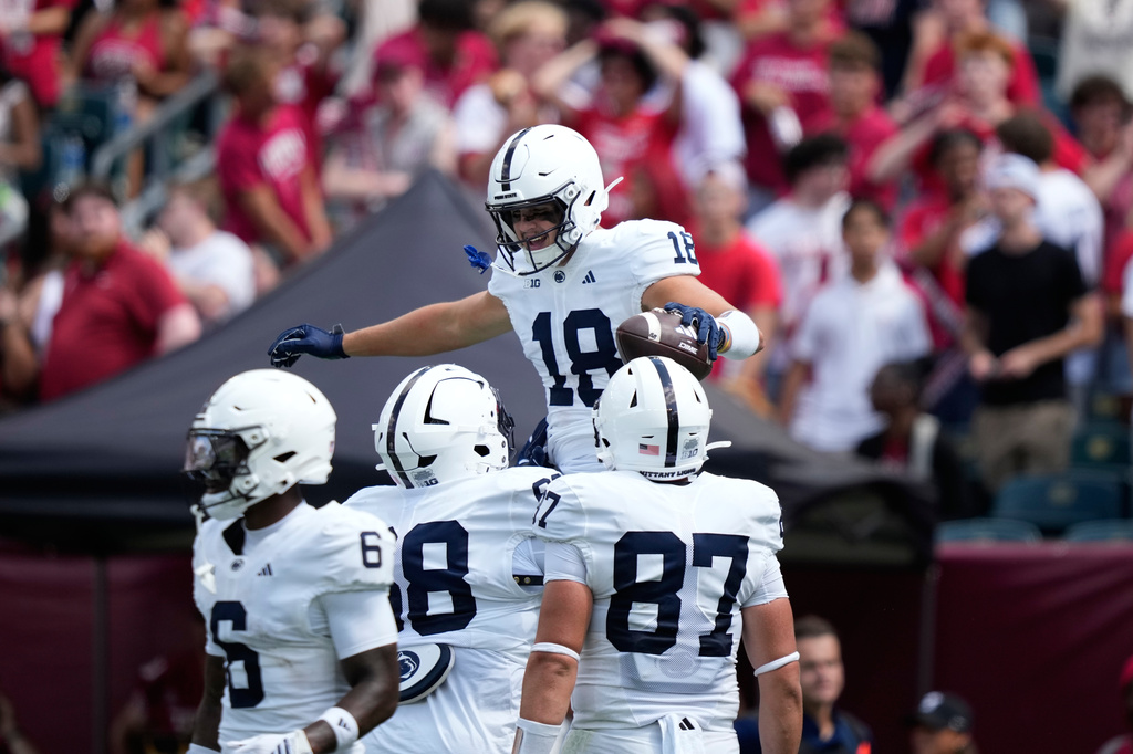 Penn State's Benjamin Brahmer (18) celebrates with teammates after scoring a touchdown during the first half of an NCAA college football game against Temple Saturday, Sept. 12, 2026, in Philadelphia. (AP Photo/Matt Slocum)