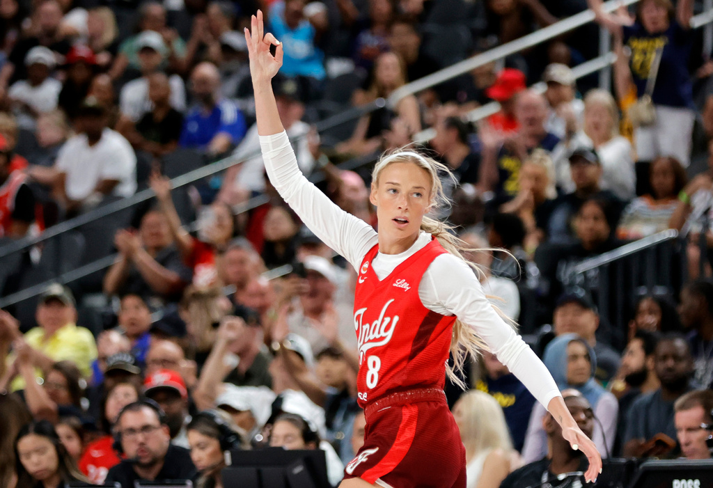 Indiana Fever guard Sophie Cunningham (8) reacts after making a basket against the Las Vegas Aces during the first half of an WNBA basketball game Sunday, July 5, 2026, in Las Vegas. (Steve Marcus/Las Vegas Sun via AP)