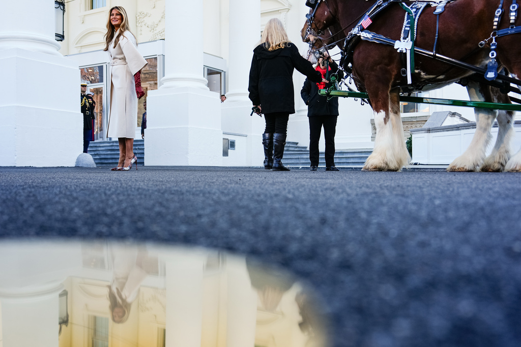 First lady Melania Trump departs after receiving the official 2025 White House Christmas Tree, a white fir from Korson's Tree Farms in Michigan, on the North Portico of the White House, Monday, Nov. 24, 2025, in Washington. (AP Photo/Julia Demaree Nikhinson)