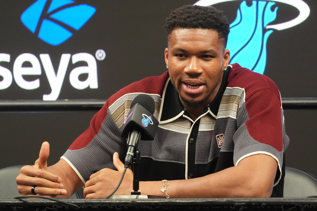 Giannis Antetokounmpo speaks during a news conference where he is introduced as a new member of the Miami Heat team Thursday, July 16, 2026, in Miami. (AP Photo/Marta Lavandier)