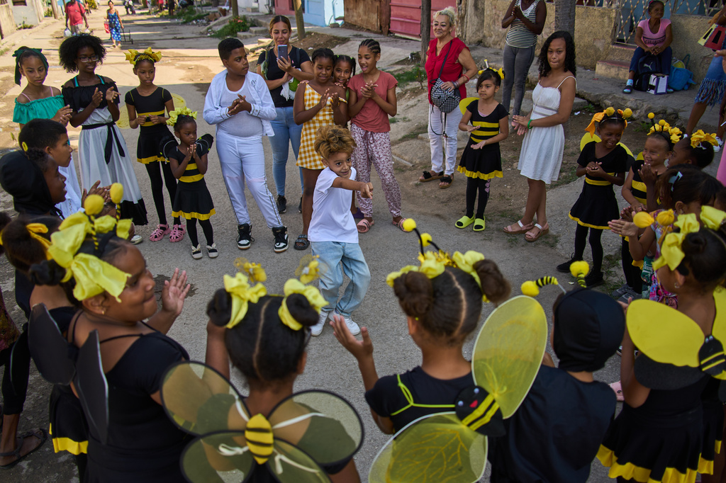 A young dancer dances during an outdoor performance led by choreographer Juan Miguel Mas, in a neighborhood of Havana, Cuba, Saturday, May 9, 2026. (AP Photo/Ramon Espinosa)