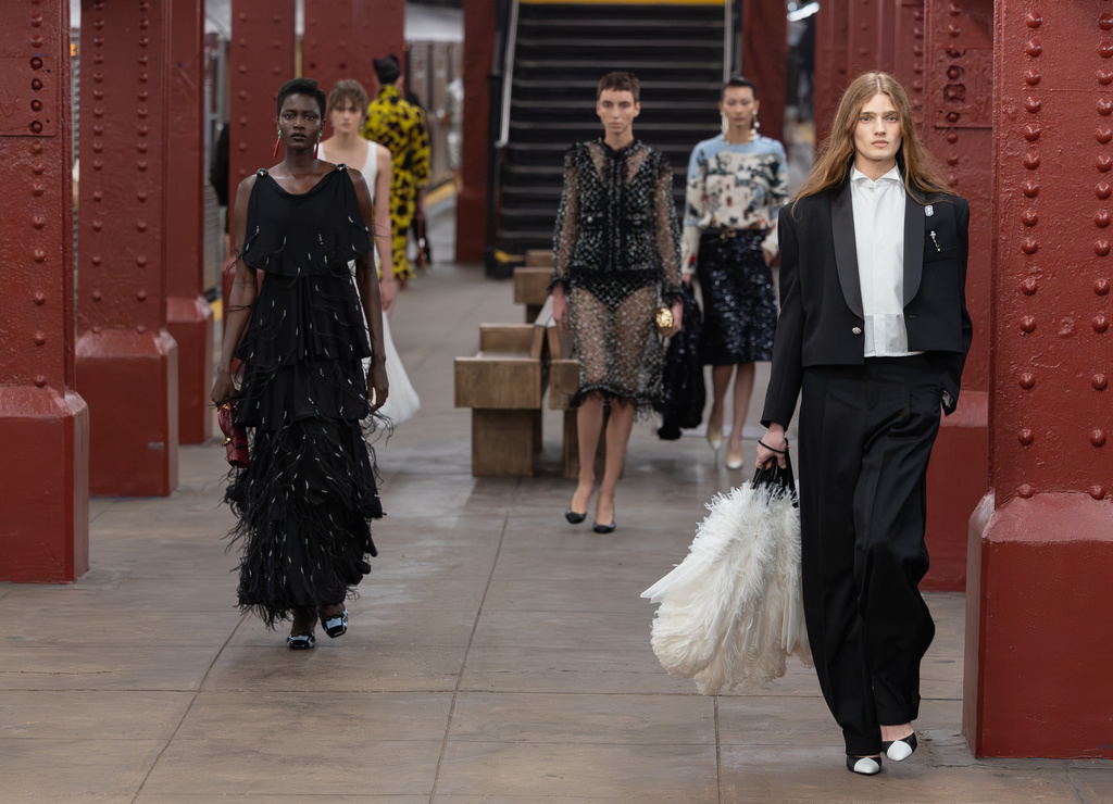 Models walk the runway during the CHANEL 2025/26 Métiers d'art fashion show at Bowery subway station on Tuesday, Dec. 2, 2025, in New York. (Photo by CJ Rivera/Invision/AP)