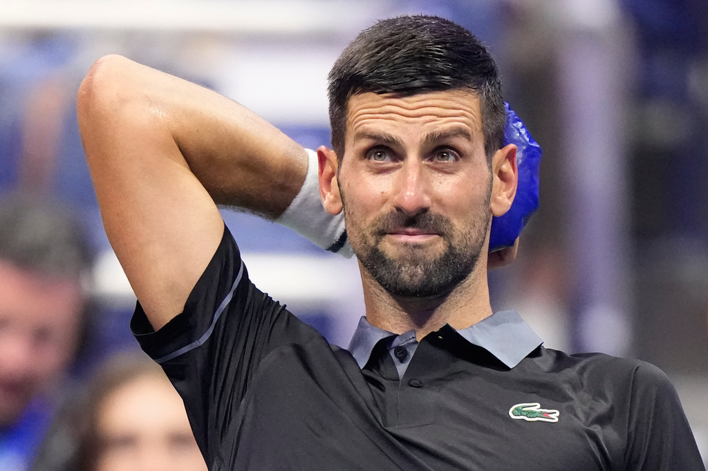 Novak Djokovic, of Serbia, cools off during a break from play in a match against Mariano Navone, of Argentina, during the first round of the U.S. Open tennis championships Sunday, Aug. 30, 2026, in New York. (AP Photo/Frank Franklin II)