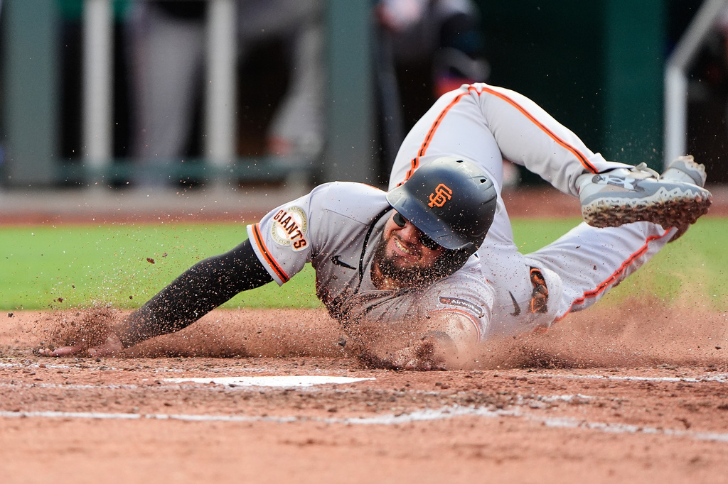 San Francisco Giants' Jesus Rodriguez slides home to score on a single by Drew Gilbert during the fifth inning of a baseball game against the Kansas City Royals, Tuesday, July 21, 2026, in Kansas City, Mo. (AP Photo/Charlie Riedel)