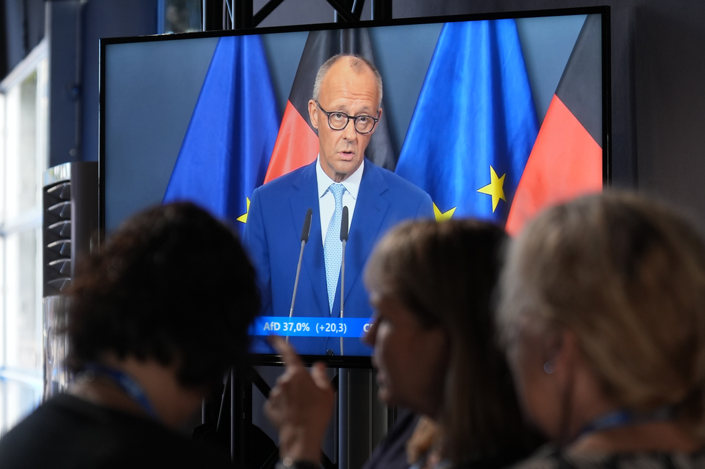 In the ARD election studio, a monitor shows Federal Chancellor Friedrich Merz (CDU) speaking following the elections in Berlin and Mecklenburg-Western Pomerania, in Berlin, Sunday, Sept. 20, 2026. (Marcus Brandt/dpa via AP)
