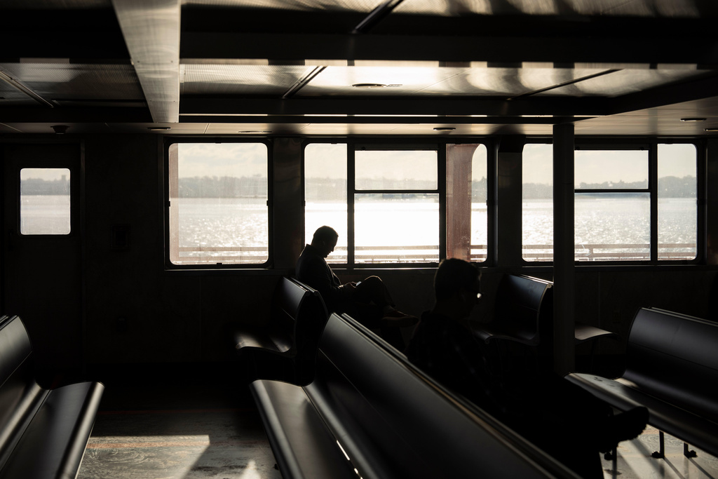A person takes the Staten Island Ferry, Tuesday, Jan. 27, 2026, in New York. (AP Photo/Yuki Iwamura)