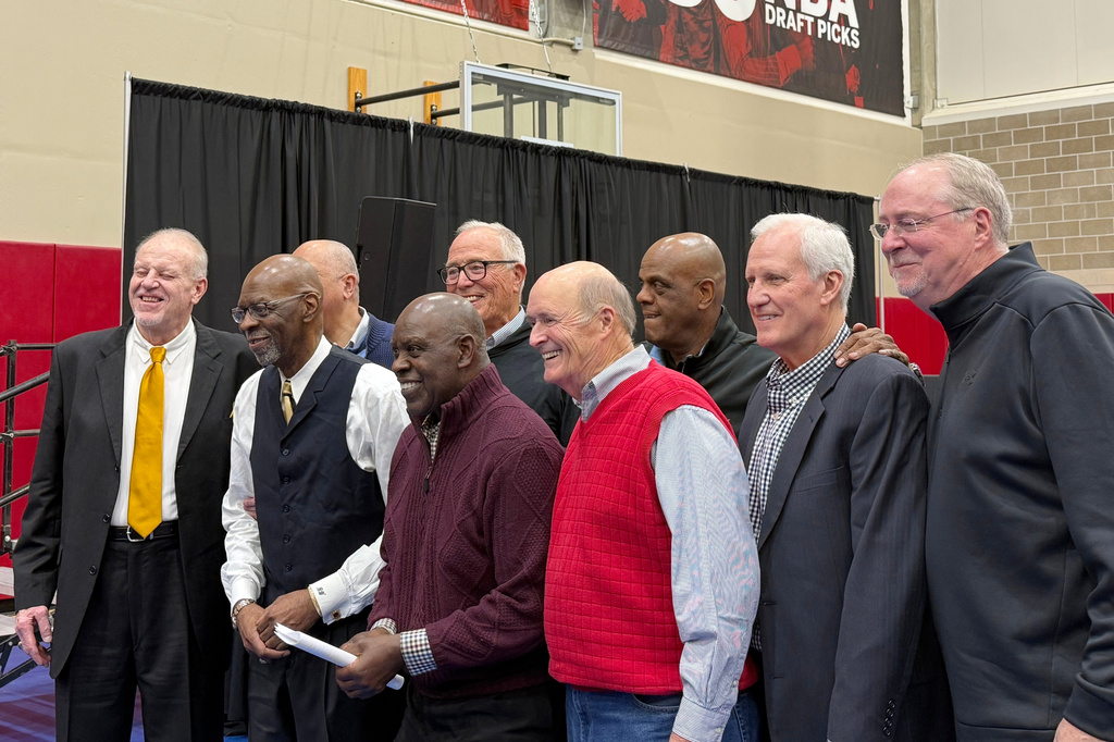 Members of the Indiana Hoosiers 1975-76 national championship team, the last undefeated men's Division I team to win the championship, gather for a reunion before a basketball game against Oregon on Feb. 9, 2026, in Bloomington, Ind. (AP Photo/Mike Marot)