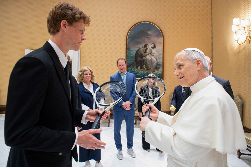 FILE - Italy's Jannik Sinner, left, shares a light moment with Pope Leo XIV on the occasion of their meeting at the Vatican, May 14, 2025. (Vatican Media via AP, File)