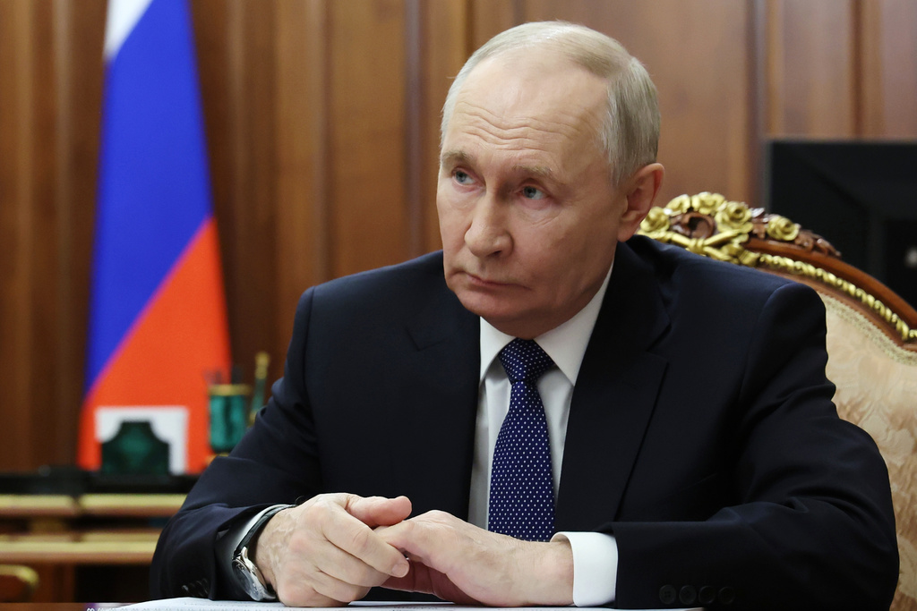 FILE - Russian President Vladimir Putin listens to Roman Artyukhin, the head of the treasury, at the Kremlin in Moscow, on Tuesday, March 3, 2026. (Gavriil Grigorov/Sputnik, Kremlin Pool Photo via AP, File)