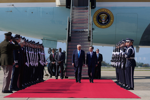 President Donald Trump, center, steps off Air Force One at Gimhae International Airport in Busan, South Korea, Wednesday, Oct. 29, 2025, after arriving from Japan. (AP Photo/Mark Schiefelbein) President Donald Trump, center, steps off Air Force One at Gimhae International Airport in Busan, South Korea, Wednesday, Oct. 29, 2025, after arriving from Japan. (AP Photo/Mark Schiefelbein)