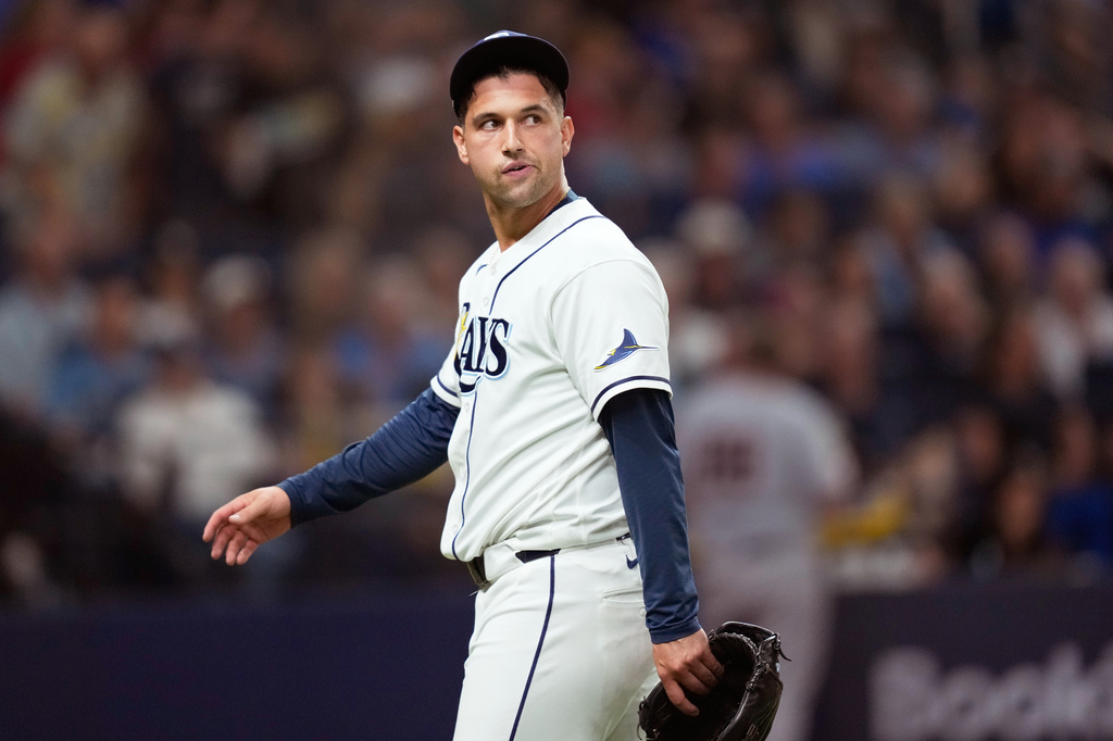 Tampa Bay Rays pitcher Ian Seymour reacts after giving up two runs against the Cleveland Guardians during the eighth inning in Game 1 of an American League Championship Series baseball game in St. Petersburg, Fla. Monday, Oct. 12, 2026. (AP Photo/David J. Phillip)