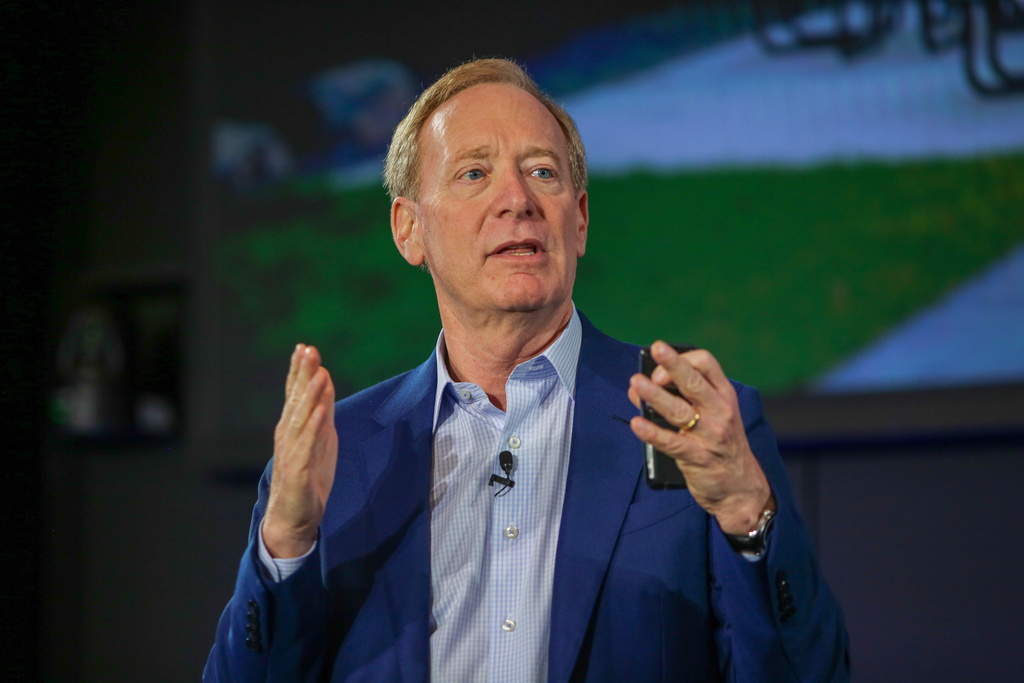 Microsoft Vice Chair and President Brad Smith speaks about the company's initiative to increase access to AI software and training for teachers and students across Washington on Thursday, Oct. 9, 2025 at the company's headquarters in Redmond, Wash. (AP Photo/Cedar Attanasio)
