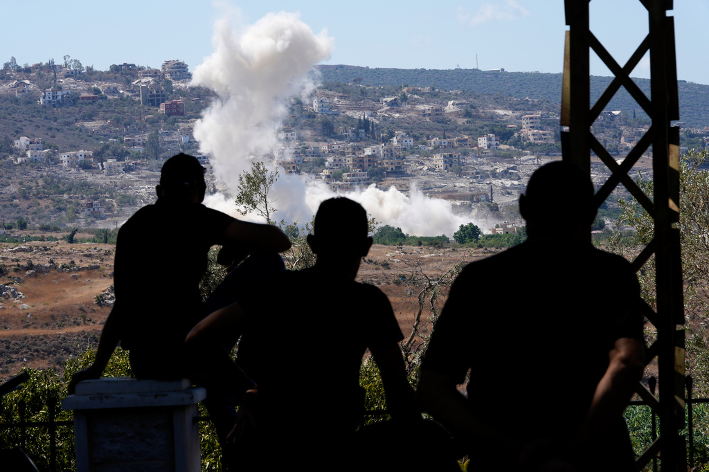 People from Mansouri watch smoke billow from an Israeli-controlled detonation destroying their village, as seen from Hanniyeh village, southern Lebanon, Friday, Sept. 11, 2026. (AP Photo/Hussein Malla)