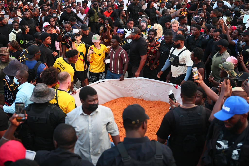 American YouTuber and online streamer Darren Jason Watkins Jr., better known as IShowSpeed, is served Ghana jollof rice at Independence Square in Accra, Ghana, during his Africa tour, Monday, Jan. 26, 2026. (AP Photo/Tsraha Yaw)