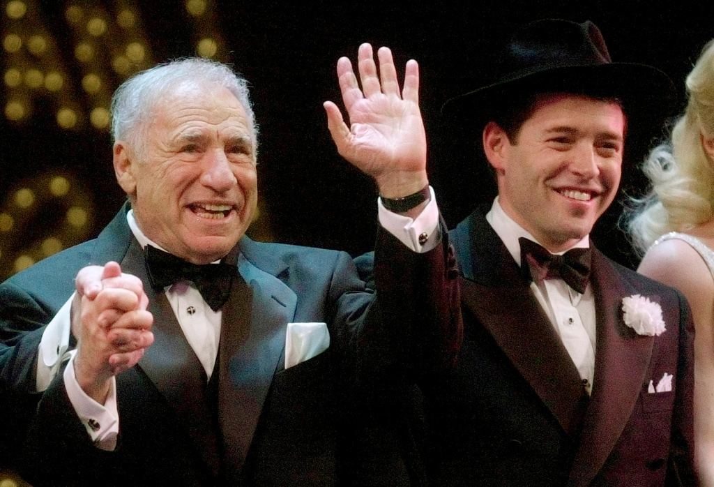 FILE - Mel Brooks, left, and Matthew Broderick react to a standing ovation at opening night of "The Producers" in New York on April 19, 2001. (AP Photo/Mark Lennihan, File)