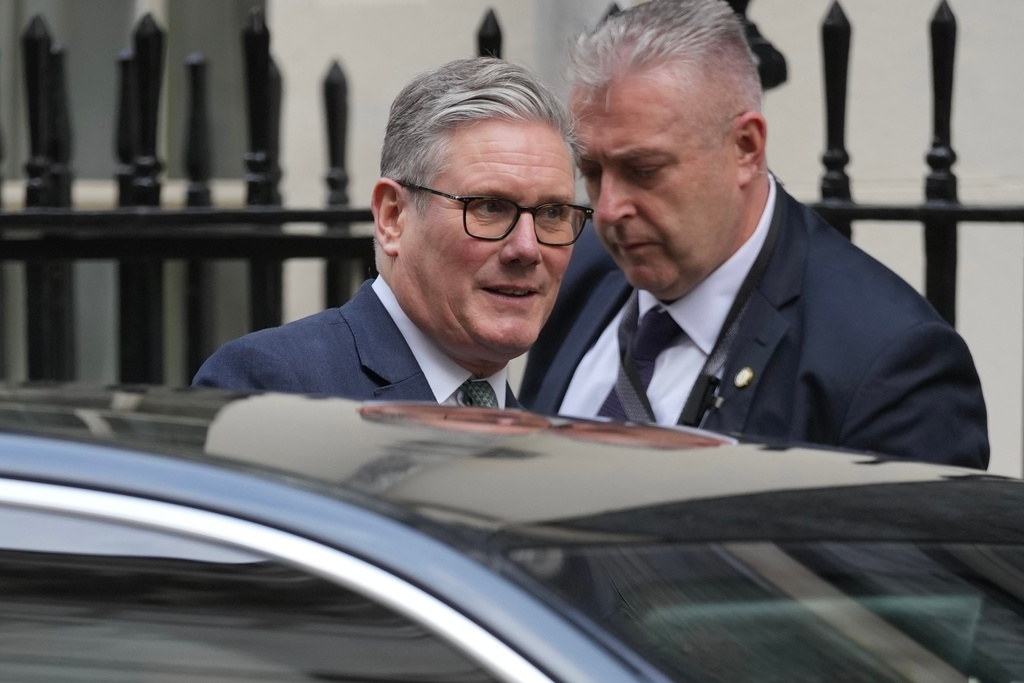 Britain's Prime Minister Keir Starmer leaves 10 Downing Street to attend the weekly Prime Ministers' Questions session in parliament in London, Wednesday, Nov. 12, 2025. (AP Photo/Kin Cheung)