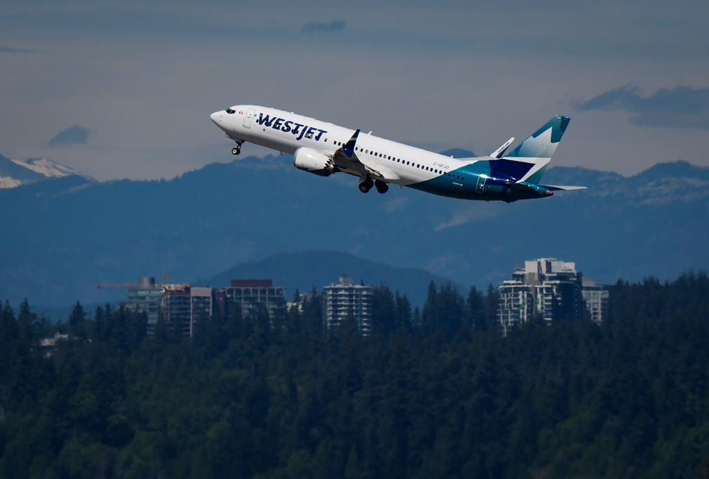 A WestJet Boeing 737 Max aircraft takes off from Vancouver International Airport in Richmond, British Columbia, Canada, on Friday, July 31, 2026. (Darryl Dyck/The Canadian Press via AP)