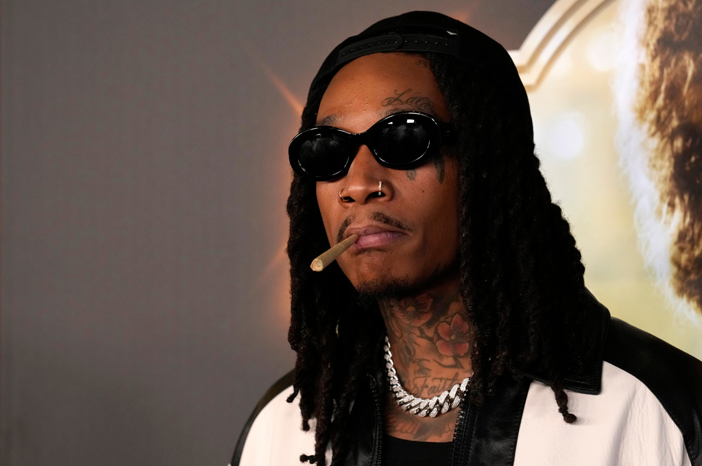 FILE - Wiz Khalifa, a cast member in "Spinning Gold," poses at the premiere of the film, Wednesday, March 29, 2023, at the Directors Guild of America in Los Angeles. (AP Photo/Chris Pizzello, File)
