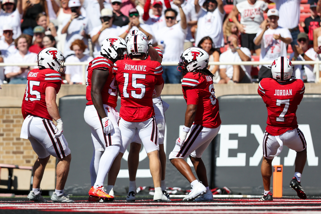 The Texas Tech defense celebrates a pick six by linebacker Austin Romaine (15) during the first half of an NCAA college football game against Sam Houston State, Saturday, Sept. 26, 2026, in Lubbock, Texas. (AP Photo/Chase Seabolt)