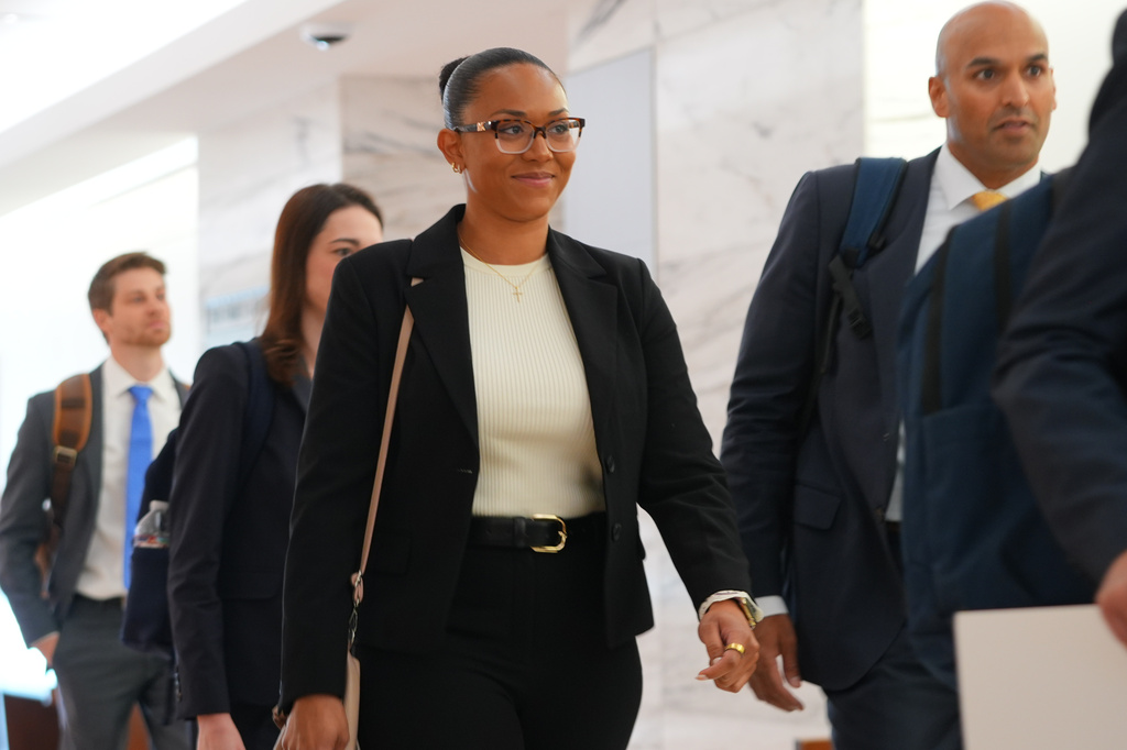 McKenna West, left, arrivers with her legal team for a court hearing in Dallas, Tuesday, Aug. 25, 2026. (AP Photo/LM Otero)