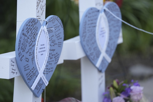 Written messages are left on hearts at a makeshift memorial at Annunciation Catholic Church after Wednesday's school shooting, Thursday, Aug. 28, 2025, in Minneapolis. (AP Photo/Abbie Parr) Written messages are left on hearts at a makeshift memorial at Annunciation Catholic Church after Wednesday's school shooting, Thursday, Aug. 28, 2025, in Minneapolis. (AP Photo/Abbie Parr)