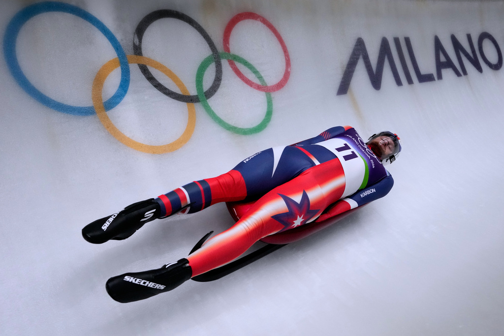 United States' Jonathan Gustafson slides down the track during a men's single luge run at the 2026 Winter Olympics, in Cortina d'Ampezzo, Italy, Saturday, Feb. 7, 2026. (AP Photo/Aijaz Rahi)