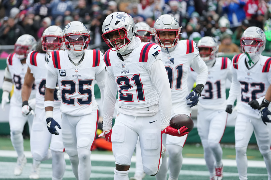 New England Patriots safety Jaylinn Hawkins (21) celebrates an interception against the New York Jets during the first half of an NFL football game, Sunday, Dec. 28, 2025, in East Rutherford, N.J. (AP Photo/Frank Franklin)