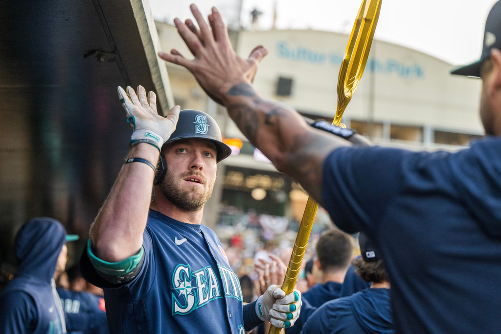 Seattle Mariners' Luke Raley celebrates after hitting a home run during the third inning of a baseball game against the Athletics in West Sacramento, Calif., Monday, May 25, 2026. (AP Photo/Nic Coury)