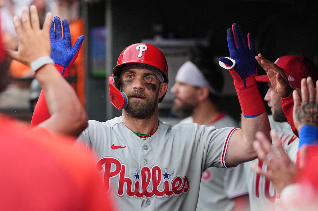 Philadelphia Phillies' Bryce Harper celebrates with teammates after hitting a home run during the fifth inning of a baseball game against the Baltimore Orioles, Sunday, Aug. 2, 2026, in Baltimore. (AP Photo/Stephanie Scarbrough)