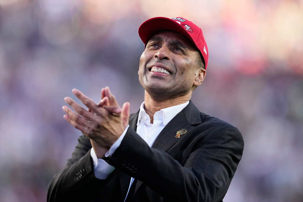 FILE - Former NFL player Roger Craig stands on the field for a tribute during the first half of the NFL Super Bowl 60 football game between the New England Patriots and the Seattle Seahawks, Sunday, Feb. 8, 2026, in Santa Clara, Calif. (AP Photo/Julio Cortez,File)