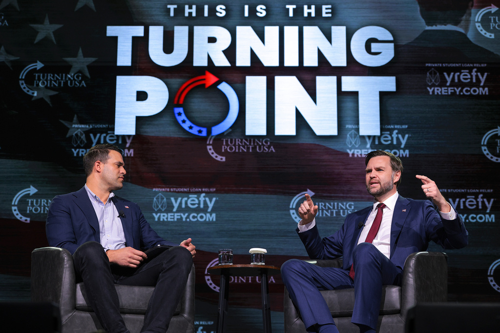 Vice President JD Vance, right, speaks with Turning Point USA spokesperson Andrew Kolvet during a Turning Point USA event at Akins Ford Arena at the Classic Center in Athens, Ga., Tuesday, April 14, 2026. (Chip Somodevilla/Pool via AP)