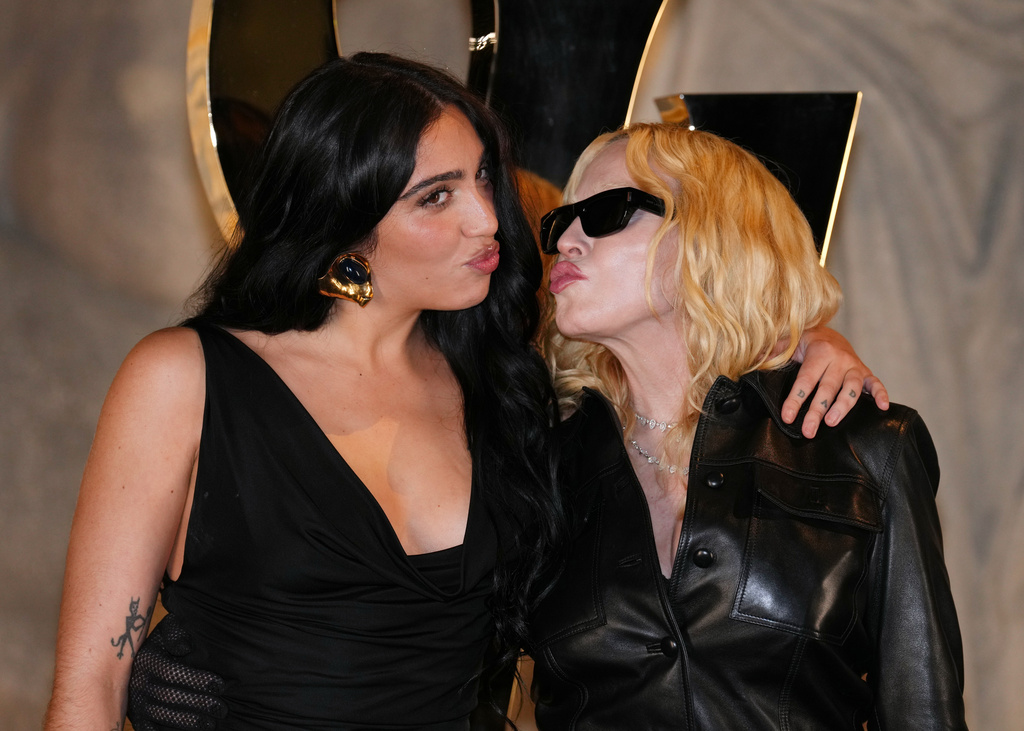 Madonna and her daughter Lourdes Leon pose before the Saint Laurent Spring/Summer 2026 collection presented in Paris, Monday, Sept. 29, 2025. (AP Photo/Aurelien Morissard)
