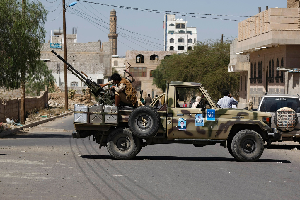 FILE - A Houthi Shiite rebel mans a machine gun mounted on a military truck in Sanaa, Yemen, Monday, Oct. 20, 2014. (AP Photo/Hani Mohammed, File)