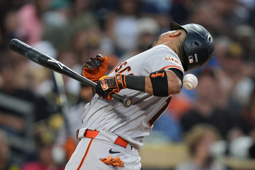 San Francisco Giants' Luis Arraez is hit by a pitch while batting during the fourth inning of a baseball game against the San Diego Padres Thursday, July 30, 2026, in San Diego. (AP Photo/Gregory Bull)