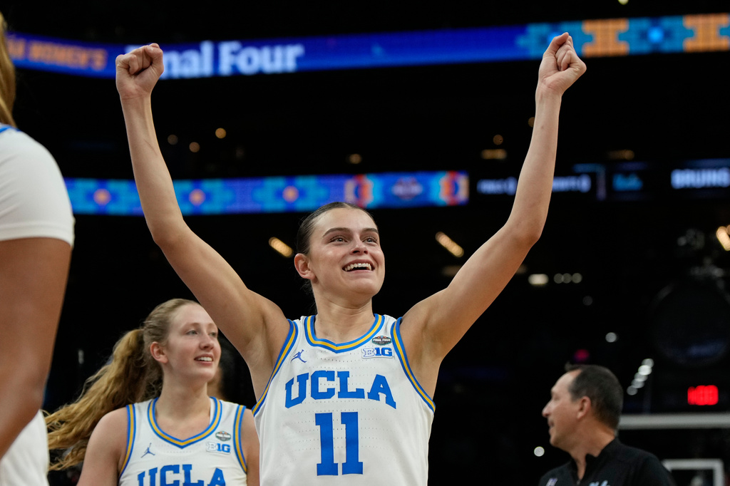 UCLA guard Gabriela Jaquez (11) celebrates after UCLA defeated Texas in a women's NCAA college basketball tournament semifinal game at the Final Four, Friday, April 3, 2026, in Phoenix. (AP Photo/Ross D. Franklin)