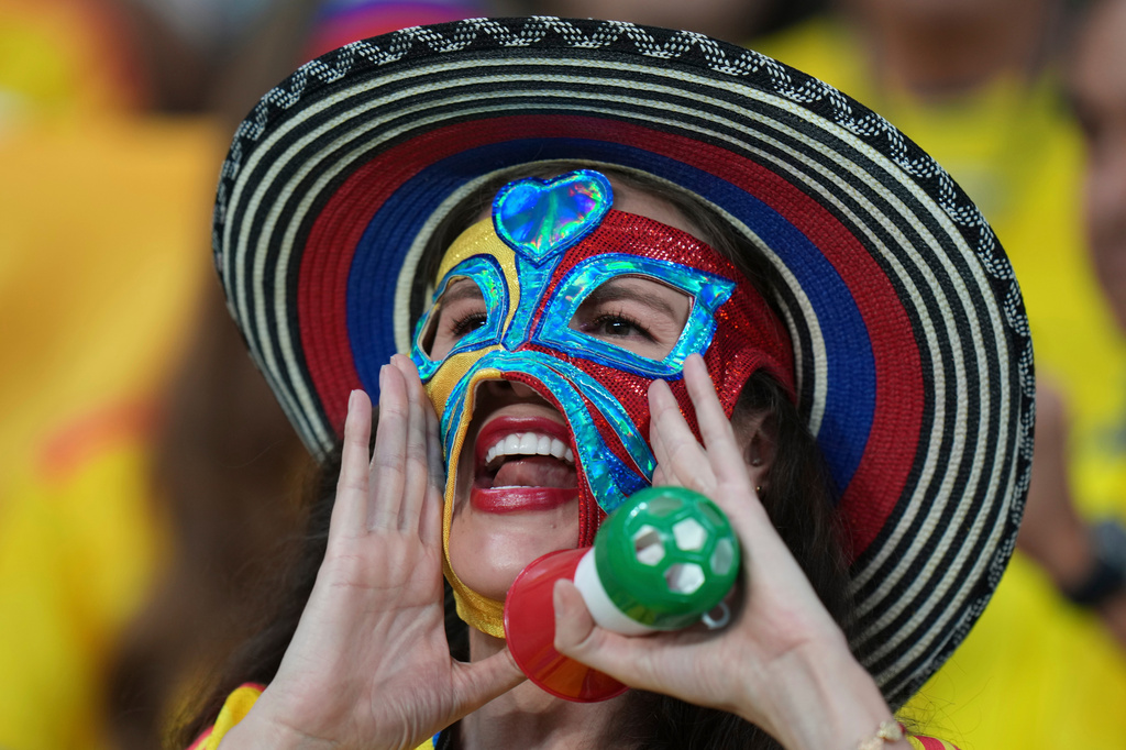A fan of Colombia cheers before the World Cup Group K soccer match between Uzbekistan and Colombia in Mexico City, Wednesday, June 17, 2026. (AP Photo/Eduardo Verdugo)