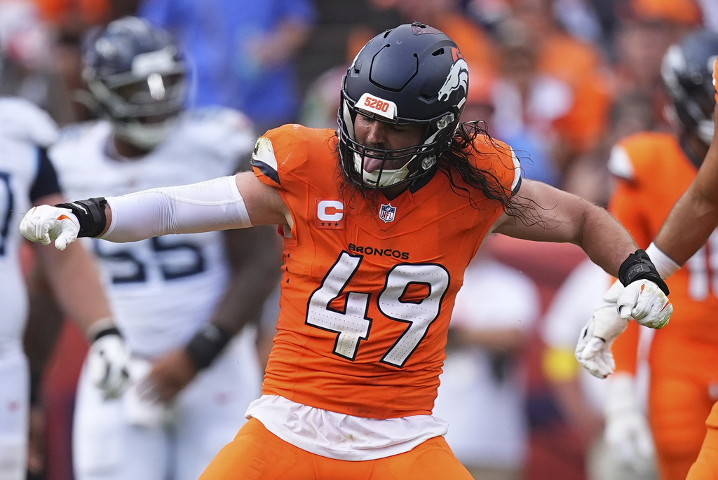 Denver Broncos linebacker Alex Singleton (49) celebrates a defensive stop during the second half of an NFL football game against the Tennessee Titans, Sunday, Sept. 7, 2025, in Denver. (AP Photo/David Zalubowski)